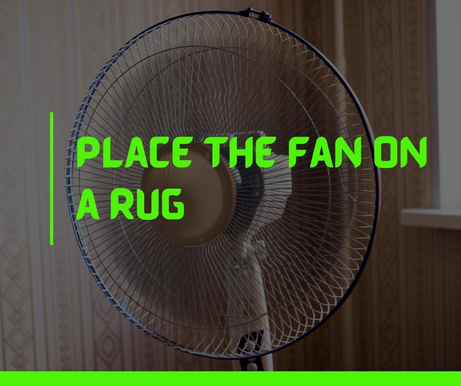 Place the fan on a rug